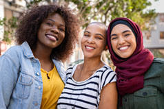 three ladies with big smiles